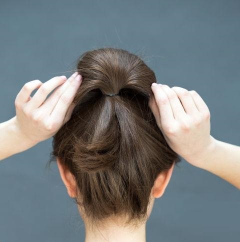 Making bun with a high ponytail
